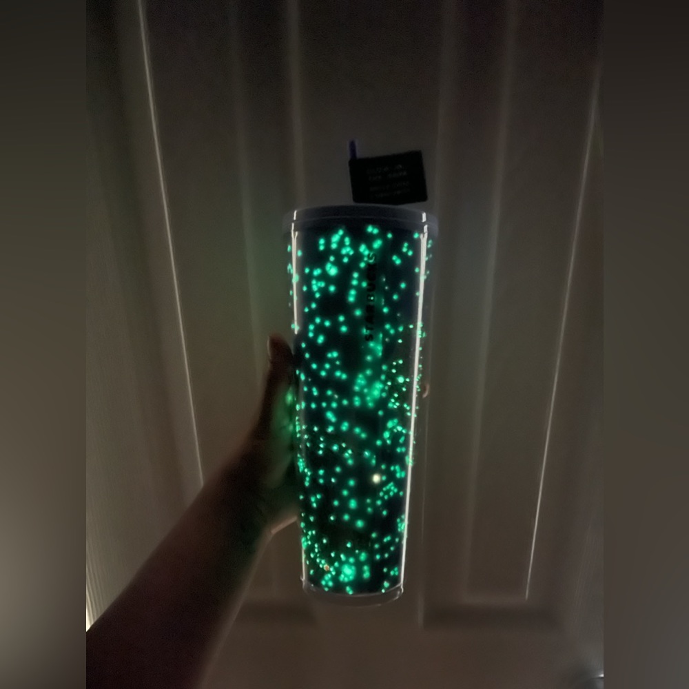 Glow in the dark raven Starbucks cup with tags attached